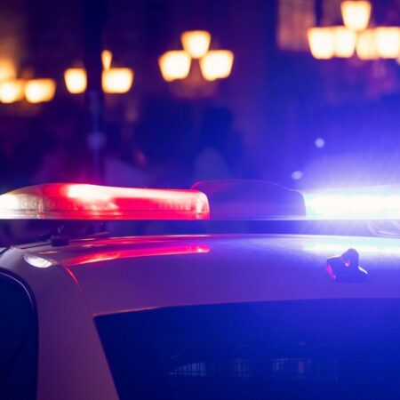Photo of police car with lights flashing